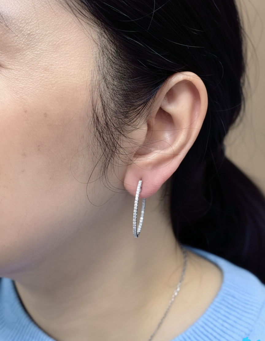 18K white gold diamond hoop earrings with pavé-set diamonds by Emirates Diamonds