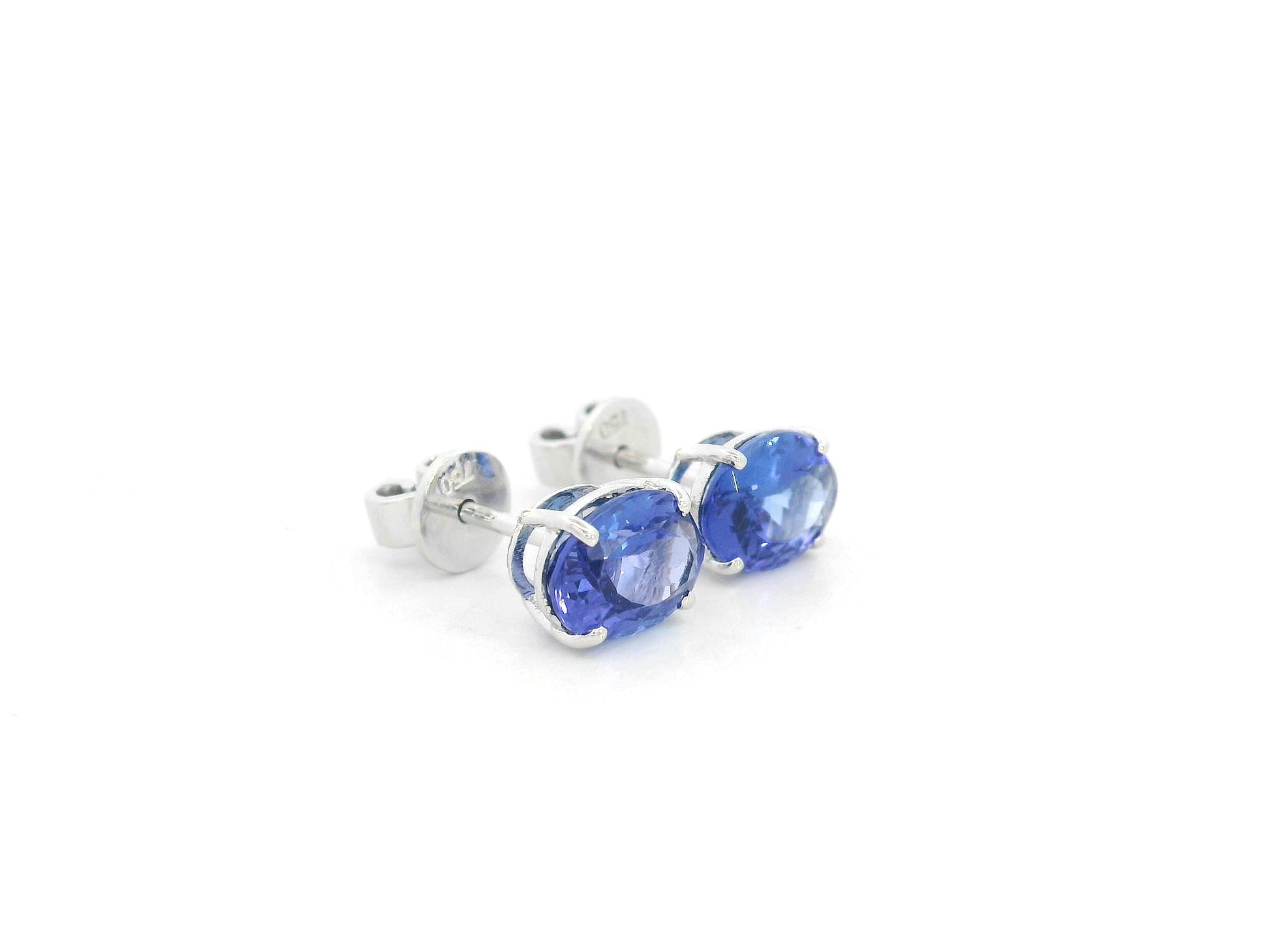 18K white gold tanzanite stud earrings with oval-cut natural tanzanites by Emirates Diamonds