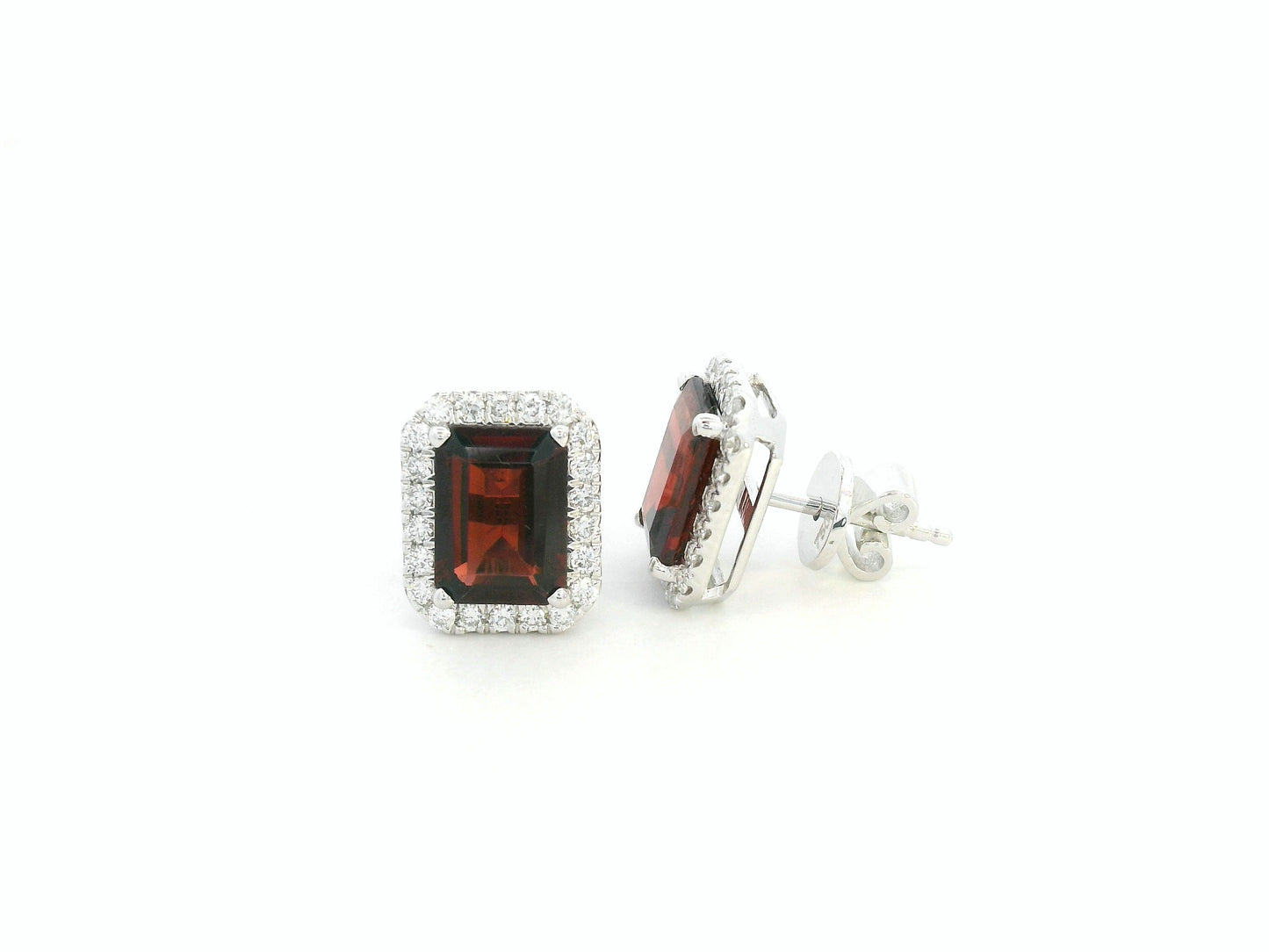 18K white gold stud earrings feature 3.34 carat emerald-cut garnets with 0.37 carat diamond accents by Emirates Diamonds.