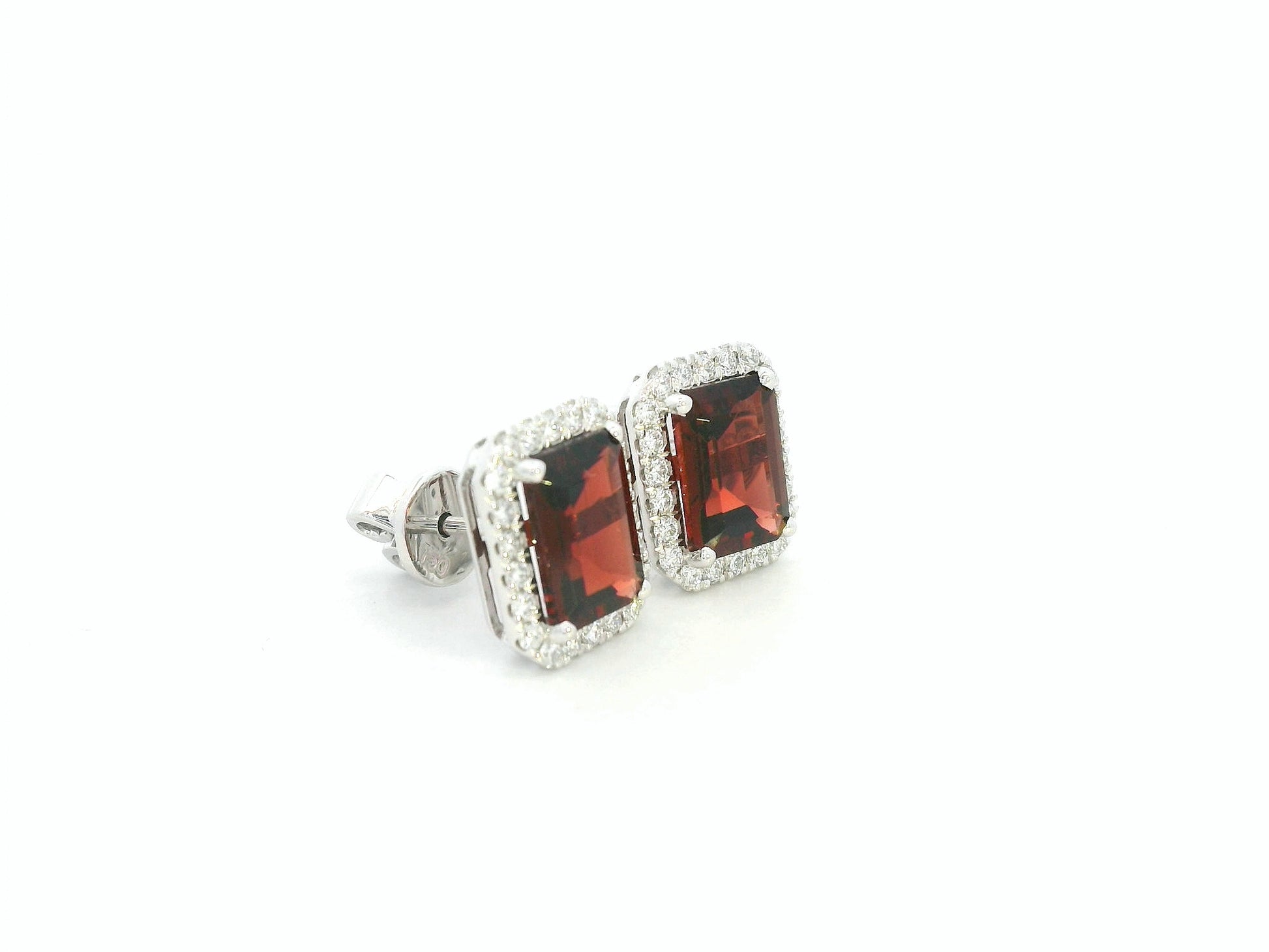 18K white gold stud earrings feature 3.34 carat emerald-cut garnets with 0.37 carat diamond accents by Emirates Diamonds.