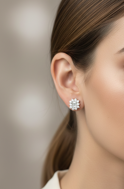 Round and baguette diamond cluster stud earrings in 18K white gold with 0.96 carat natural diamonds by Emirates Diamonds.