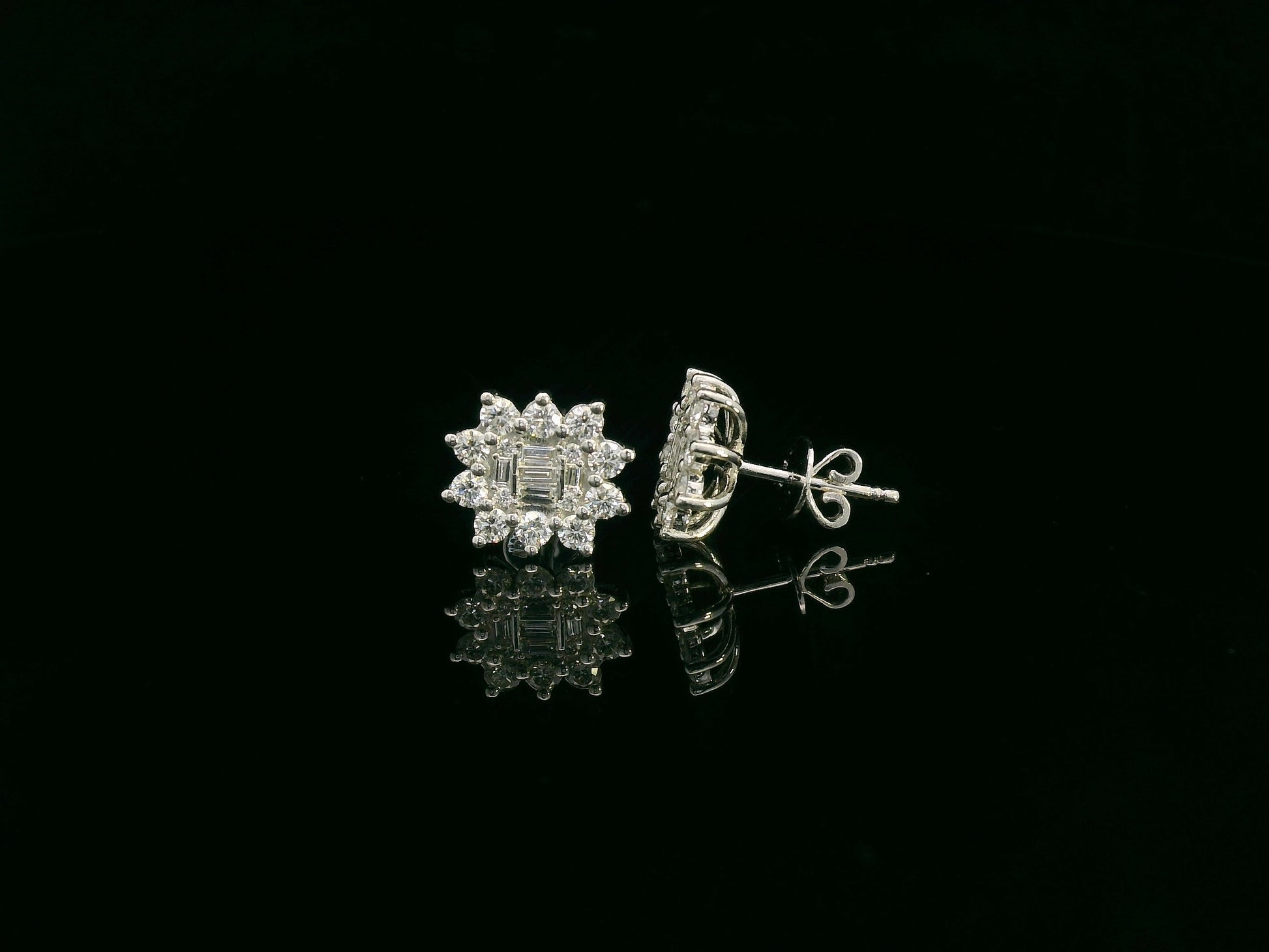 Round and baguette diamond cluster stud earrings in 18K white gold with 0.96 carat natural diamonds by Emirates Diamonds.