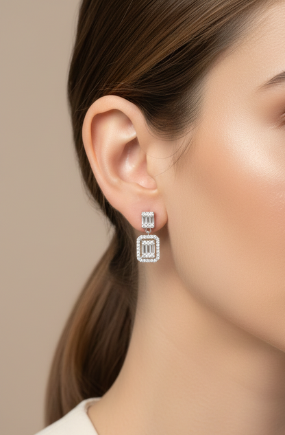 18K white gold diamond drop earrings with baguette-cut center and halo setting – Emirates Diamonds