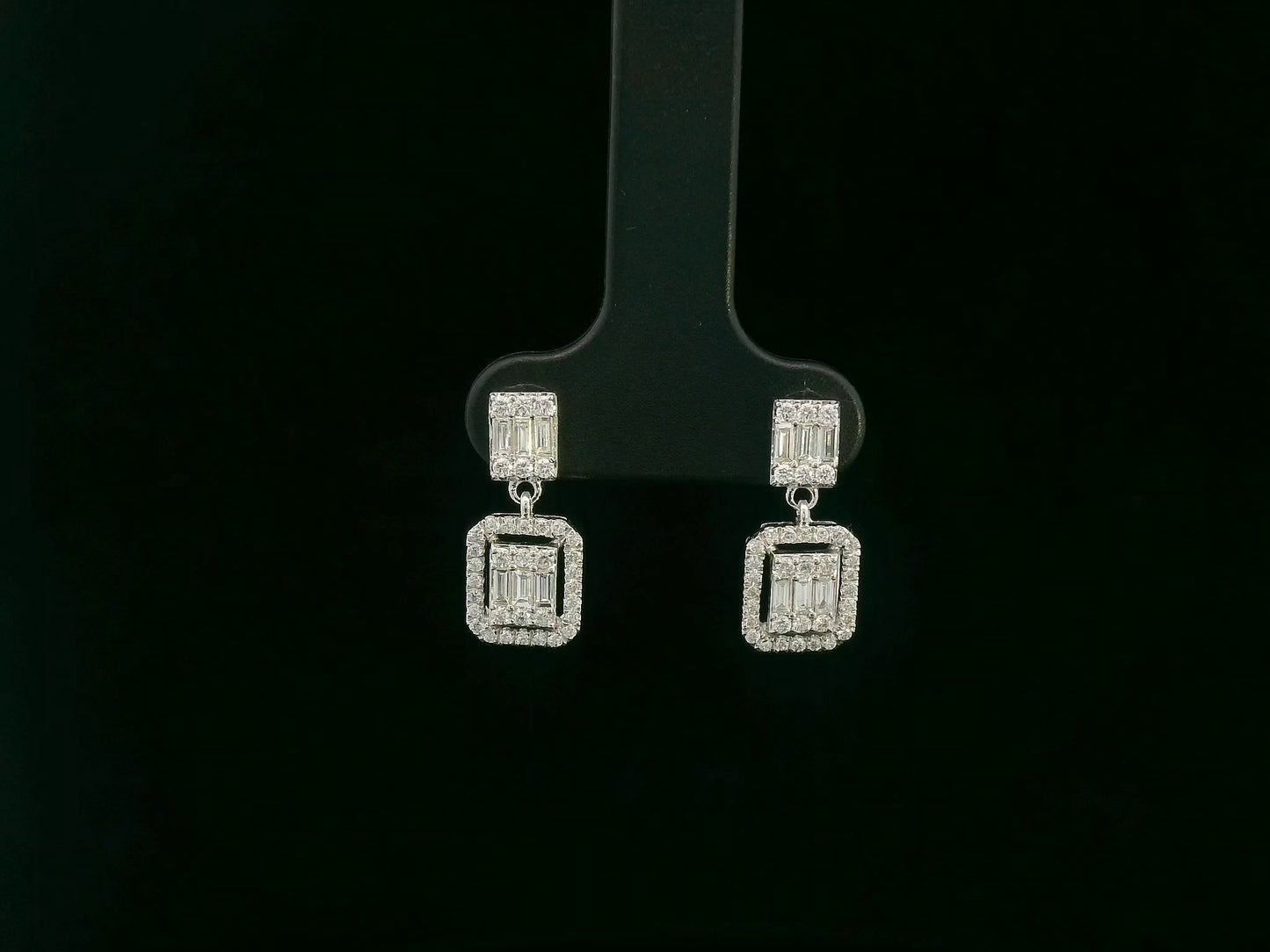 18K white gold diamond drop earrings with baguette-cut center and halo setting – Emirates Diamonds