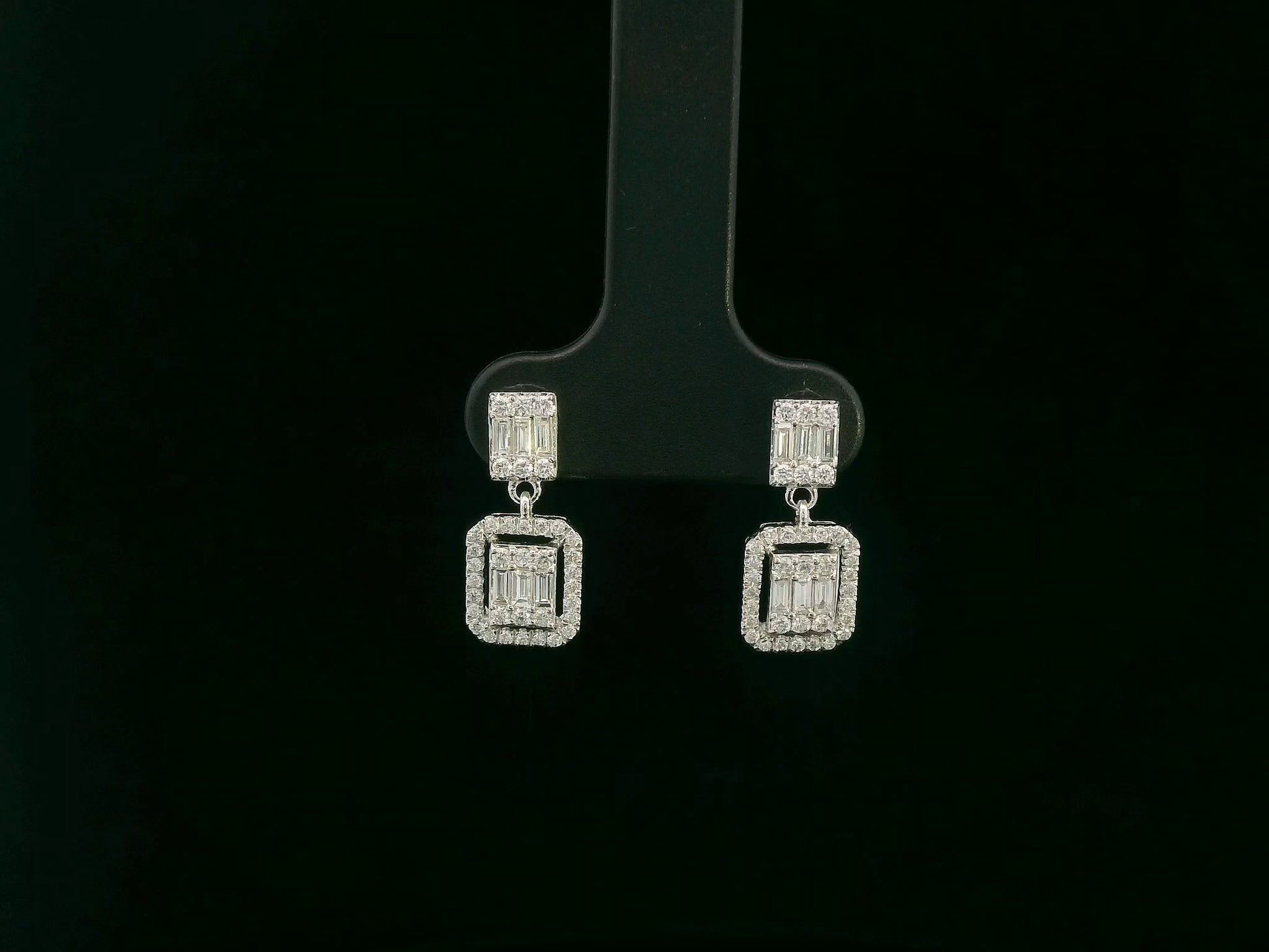 18K white gold diamond drop earrings with baguette-cut center and halo setting – Emirates Diamonds