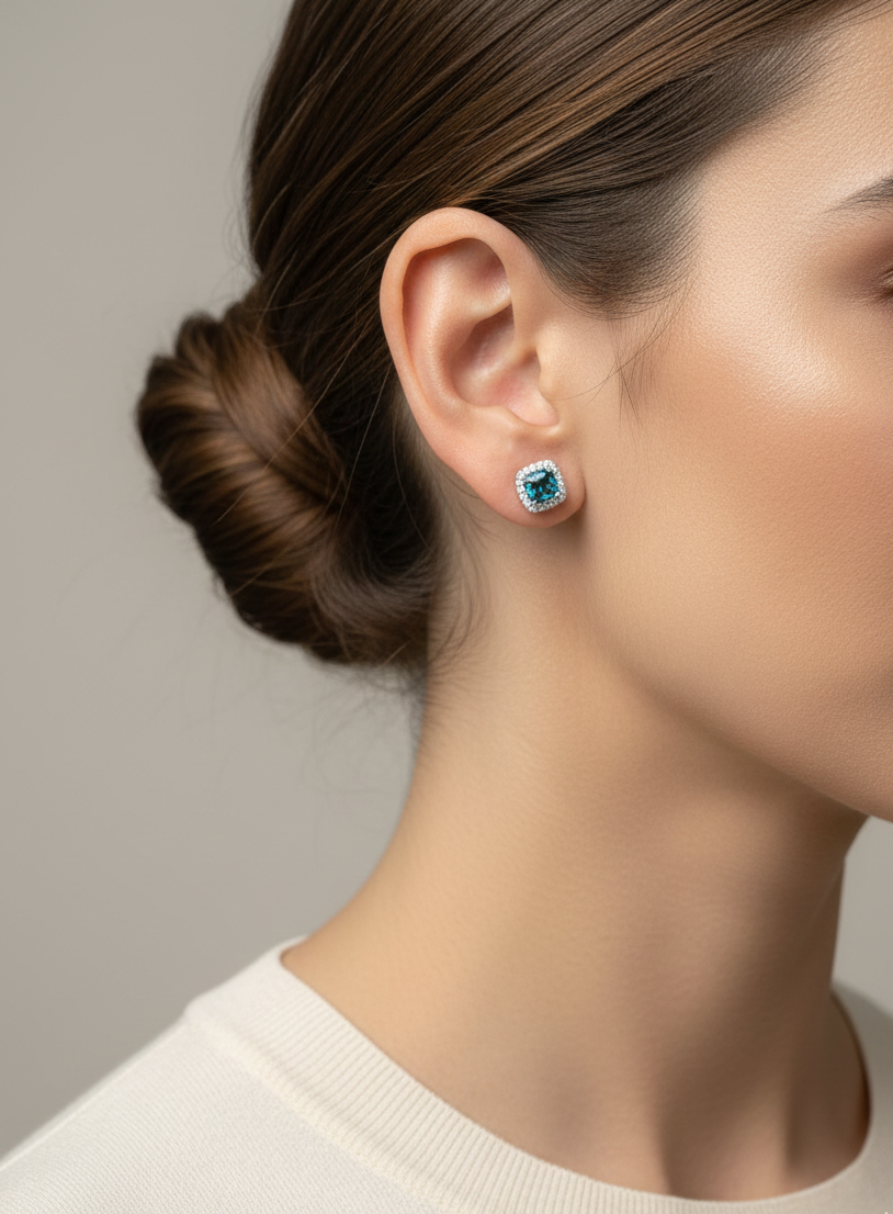 18K white gold blue topaz and diamond halo stud earrings by Emirates Diamonds
