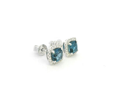 18K white gold blue topaz and diamond halo stud earrings by Emirates Diamonds