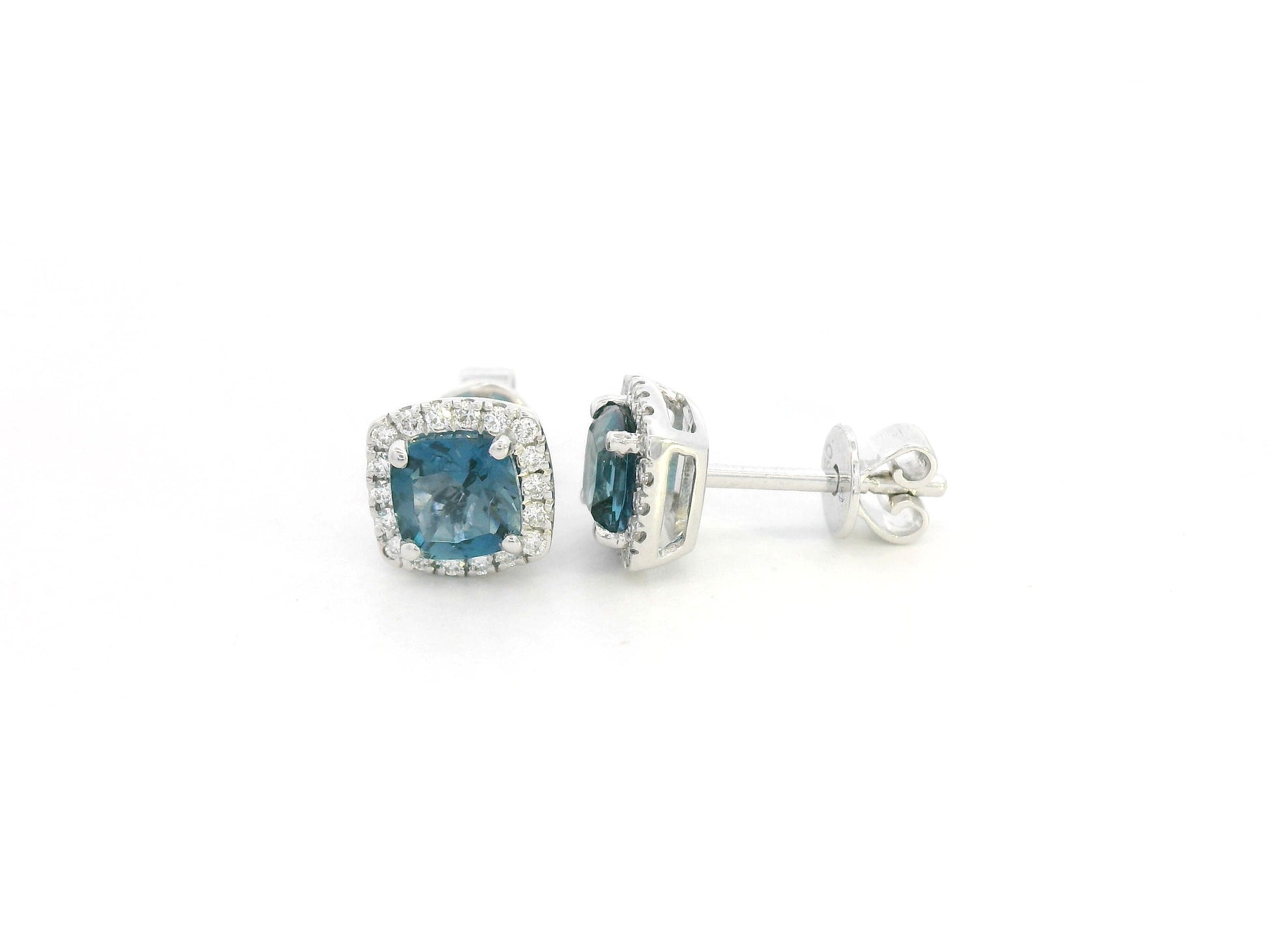 18K white gold blue topaz and diamond halo stud earrings by Emirates Diamonds