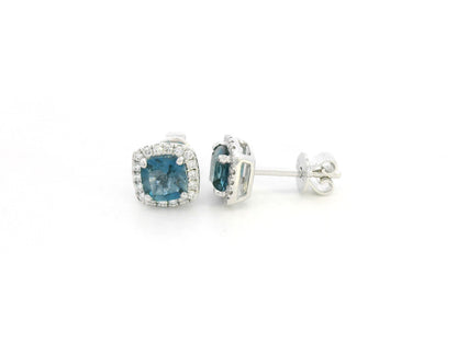 18K white gold blue topaz and diamond halo stud earrings by Emirates Diamonds