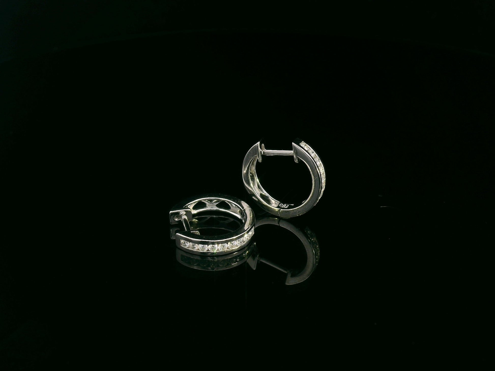 18K white gold channel-set diamond huggie earrings with round brilliant diamonds – Emirates Diamonds