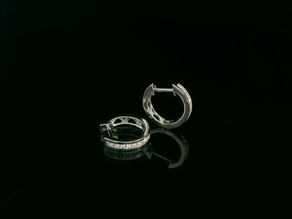 18K white gold channel-set diamond huggie earrings with round brilliant diamonds – Emirates Diamonds