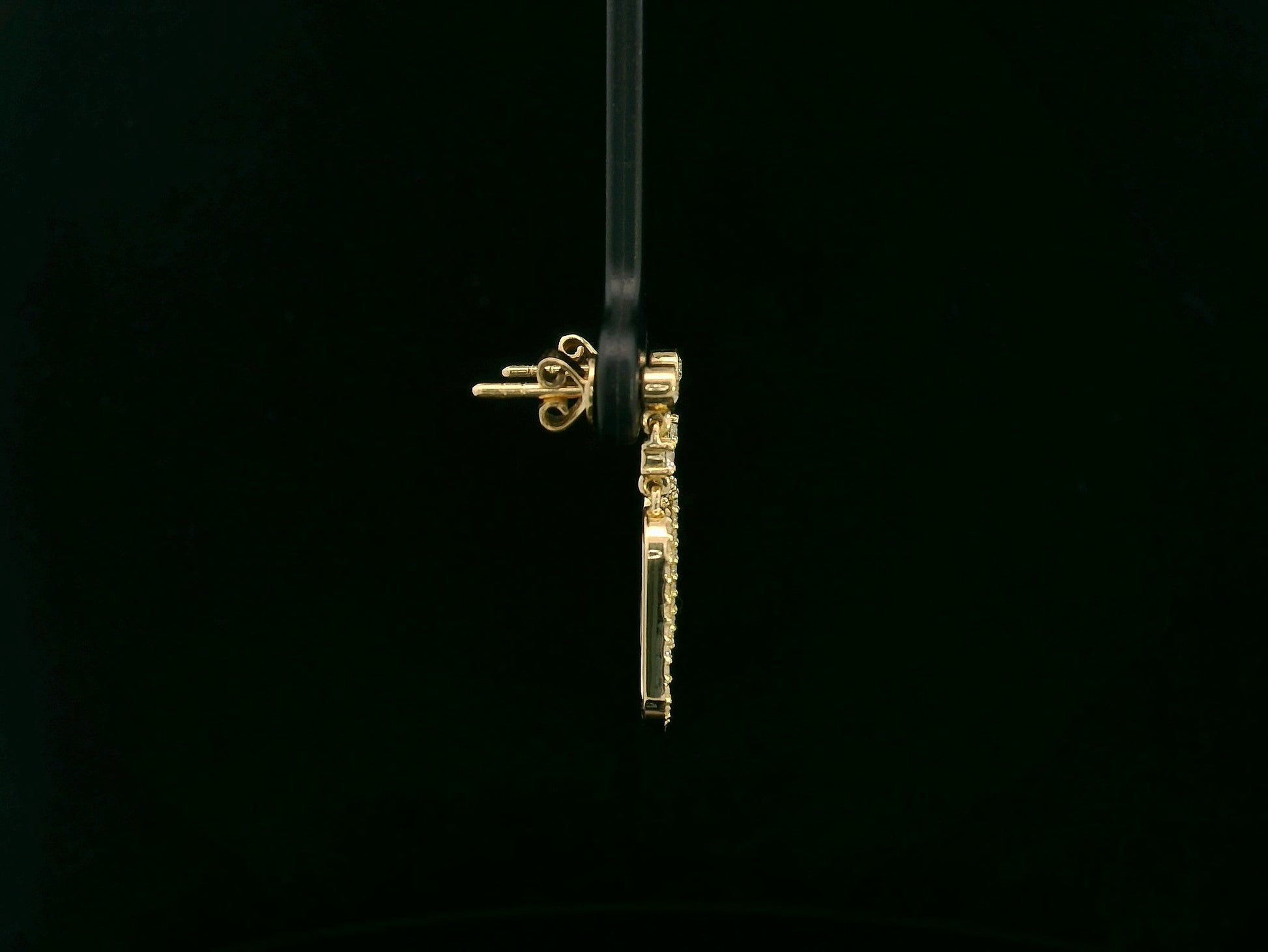 18K yellow gold diamond drop earrings featuring an elongated pavé-set oval design by Emirates Diamonds.