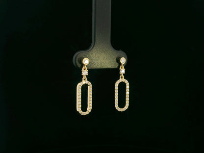 18K yellow gold diamond drop earrings featuring an elongated pavé-set oval design by Emirates Diamonds.
