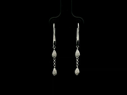 Pear-shaped diamond drop earrings in 18K white gold with 0.14 carat natural diamonds by Emirates Diamonds.