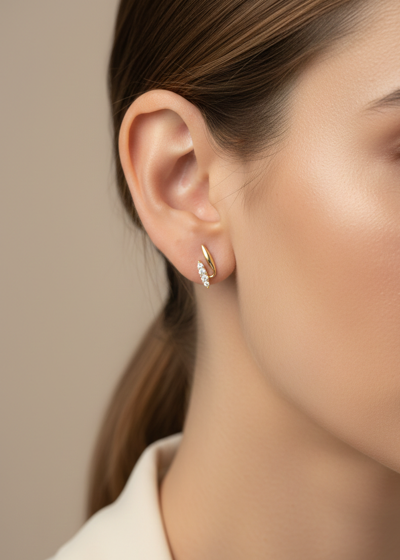 0.12 carat diamond curve stud earrings in 18K yellow gold by Emirates Diamonds