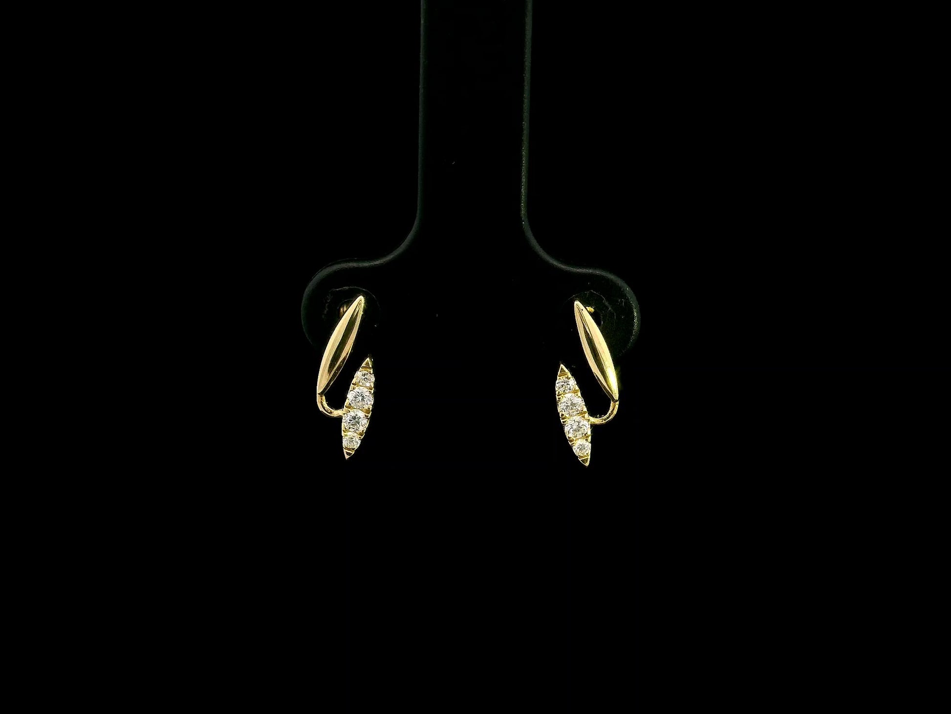 0.12 carat diamond curve stud earrings in 18K yellow gold by Emirates Diamonds