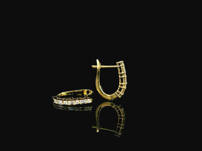 Baguette and round diamond hoop earrings in 18K yellow gold with 0.34 carat natural diamonds by Emirates Diamonds.