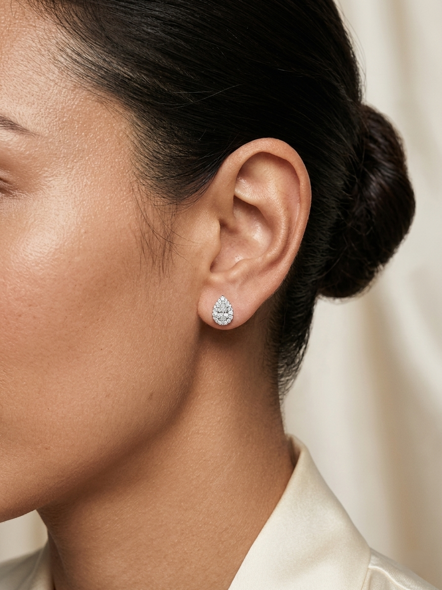 Pear cut diamond halo stud earrings in 18K white gold with GIA certified D color VS2 diamonds – Emirates Diamonds