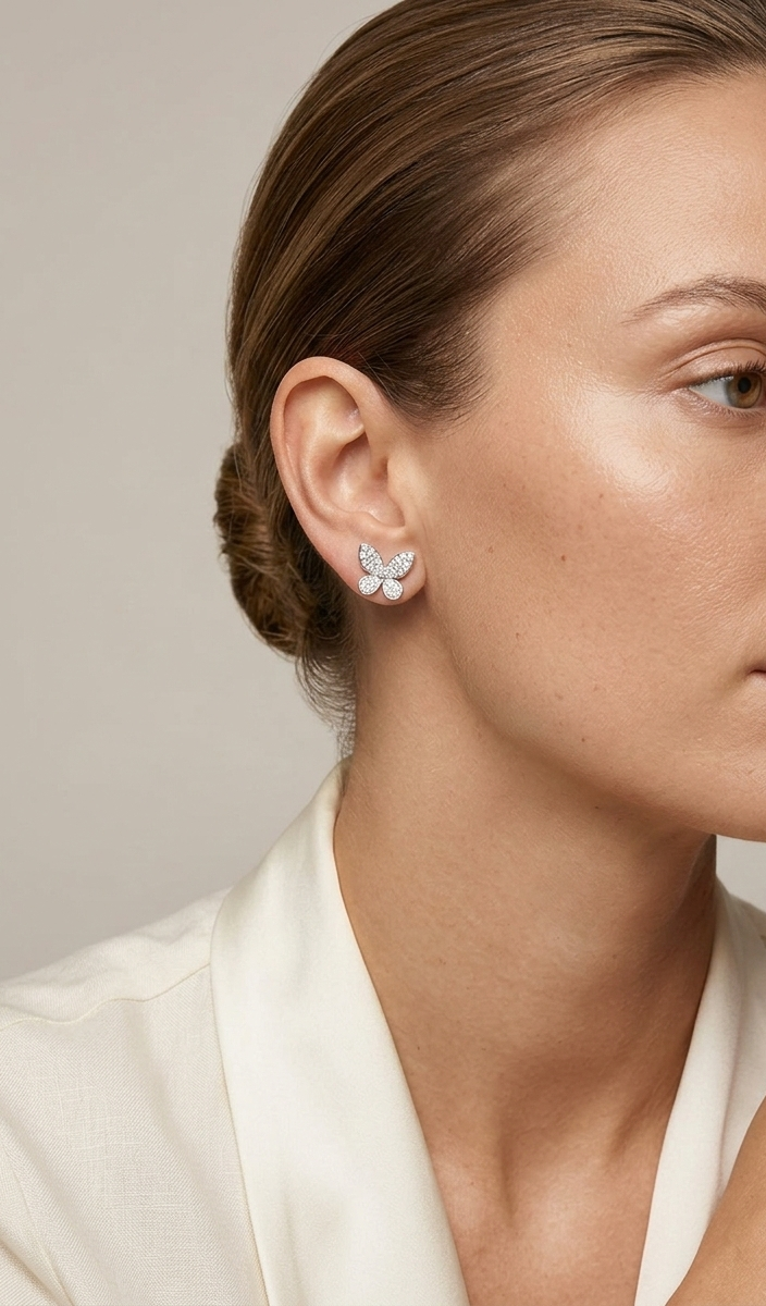 Diamond butterfly stud earrings in 18K white gold with 0.53 carat natural diamonds by Emirates Diamonds.