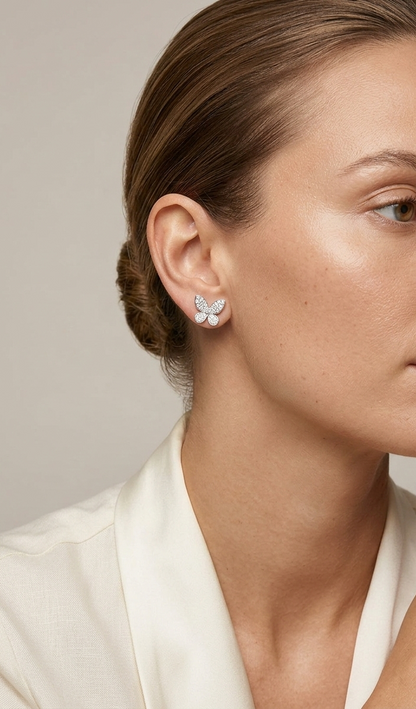 Diamond butterfly stud earrings in 18K white gold with 0.53 carat natural diamonds by Emirates Diamonds.
