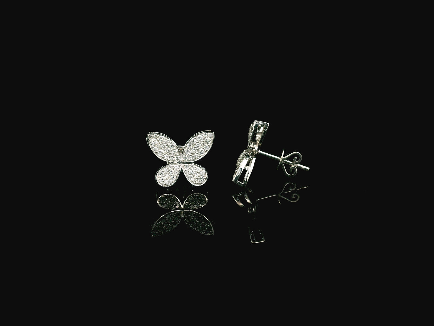 Diamond butterfly stud earrings in 18K white gold with 0.53 carat natural diamonds by Emirates Diamonds.