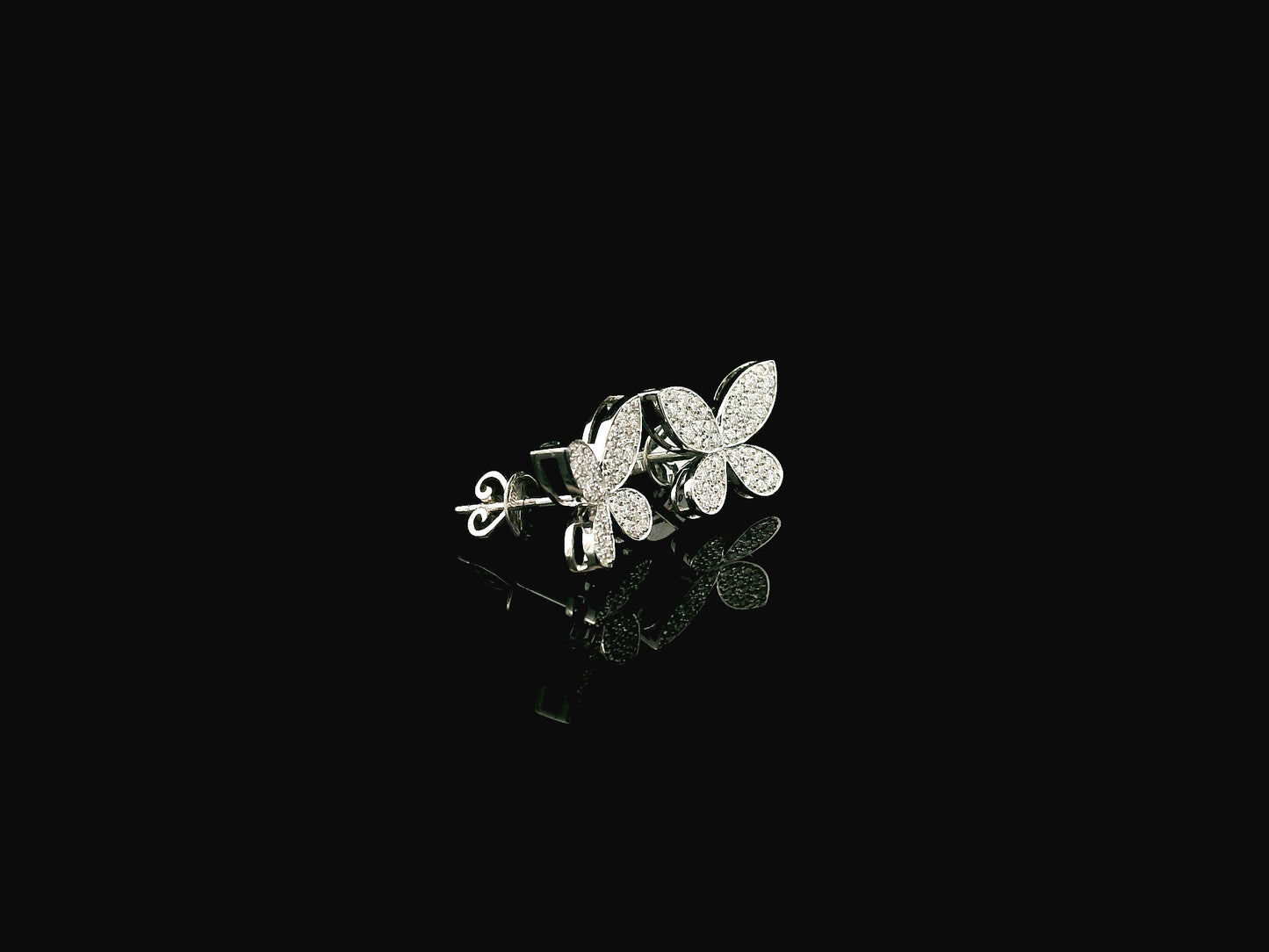Diamond butterfly stud earrings in 18K white gold with 0.53 carat natural diamonds by Emirates Diamonds.