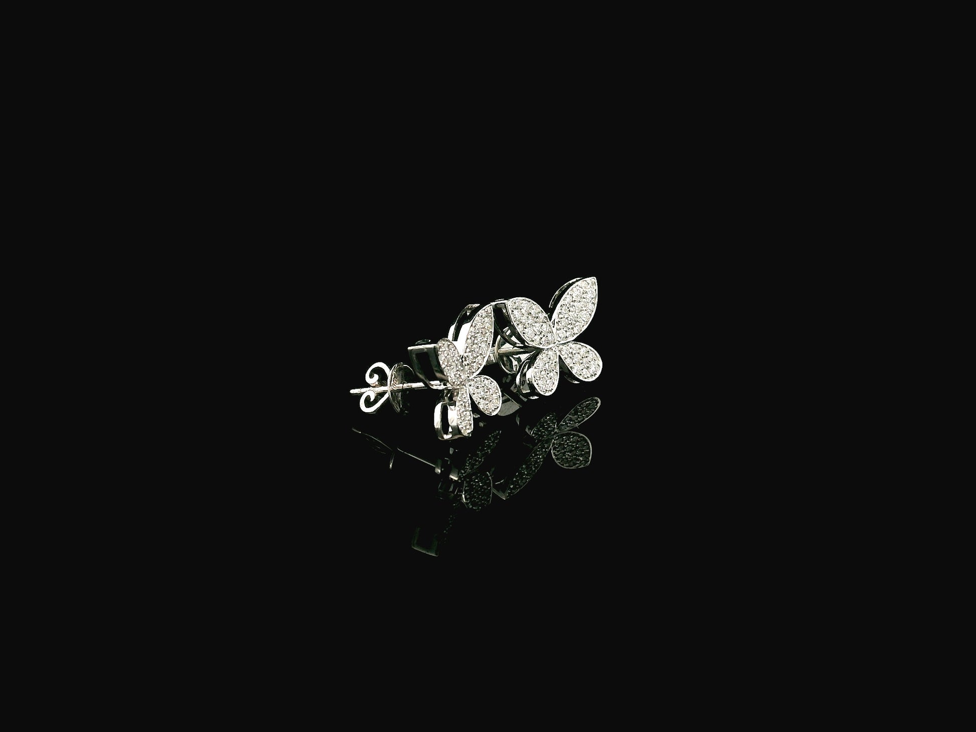 Diamond butterfly stud earrings in 18K white gold with 0.53 carat natural diamonds by Emirates Diamonds.