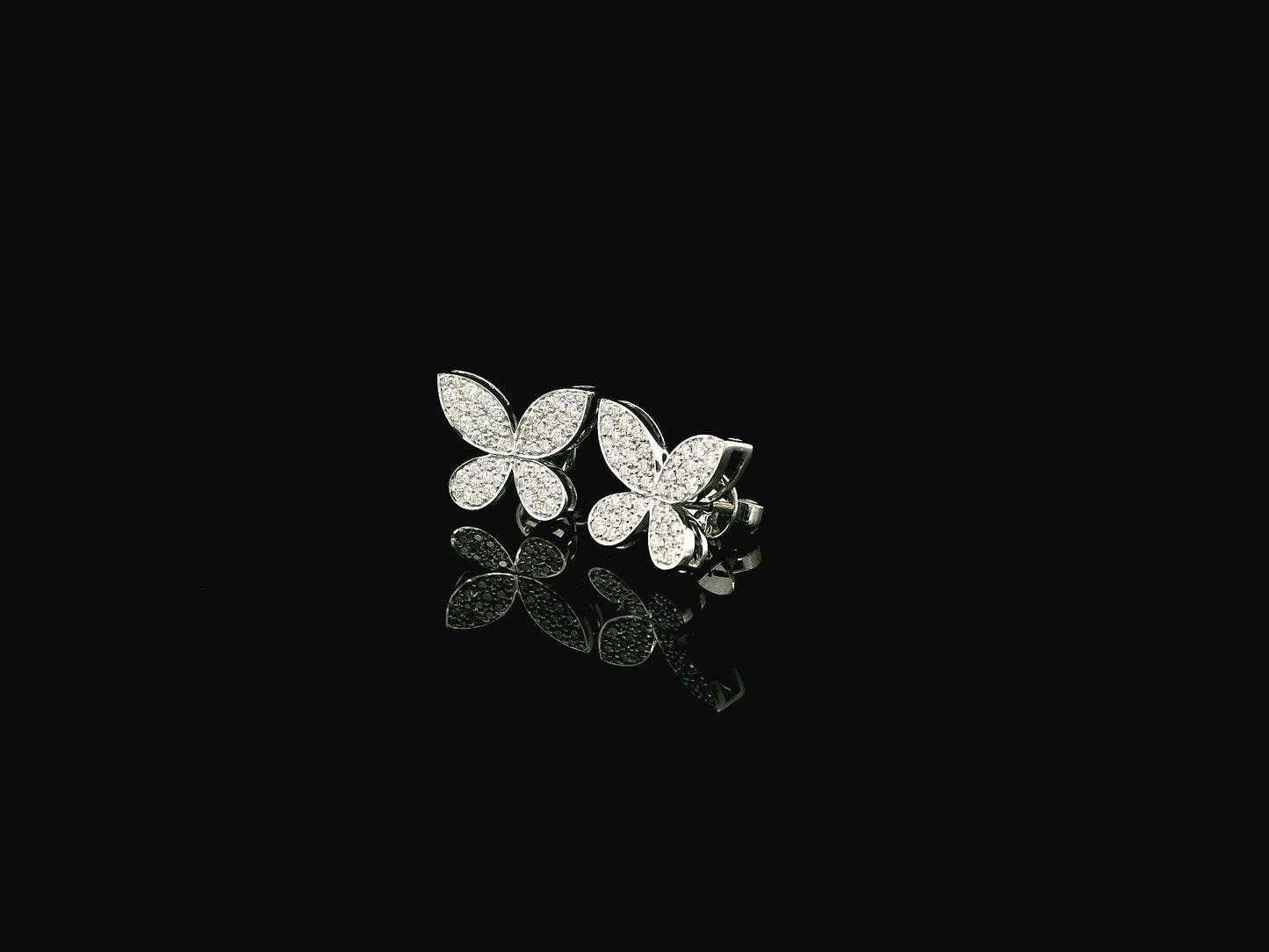 Diamond butterfly stud earrings in 18K white gold with 0.53 carat natural diamonds by Emirates Diamonds.