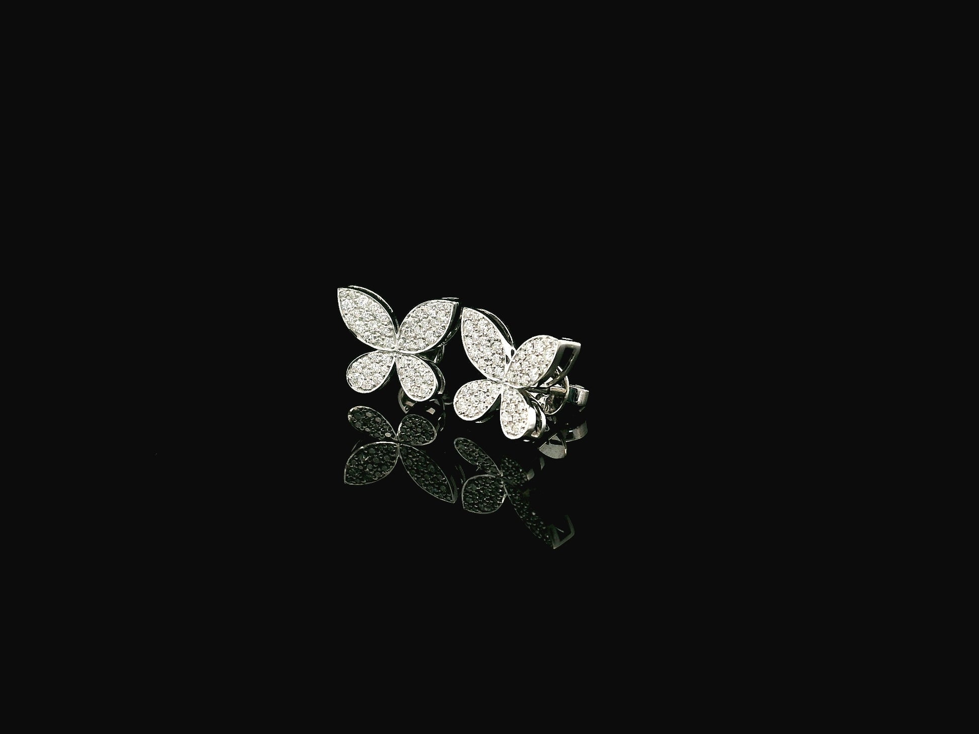 Diamond butterfly stud earrings in 18K white gold with 0.53 carat natural diamonds by Emirates Diamonds.