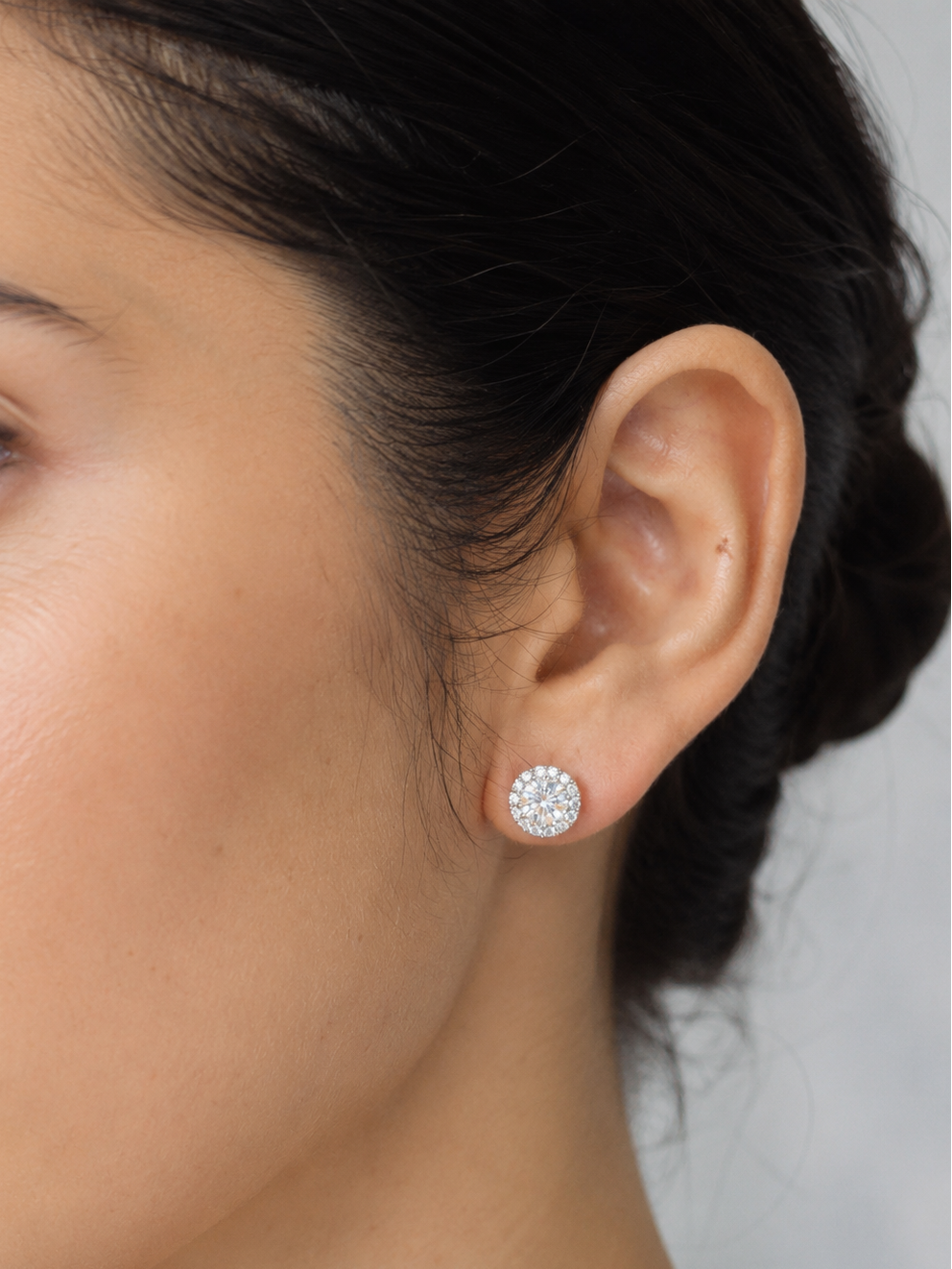 GIA certified round diamond halo stud earrings in 18K white gold with D colour natural centre diamonds