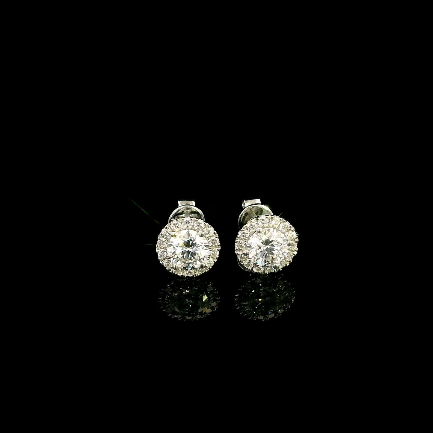 GIA certified round diamond halo stud earrings in 18K white gold with D colour natural centre diamonds