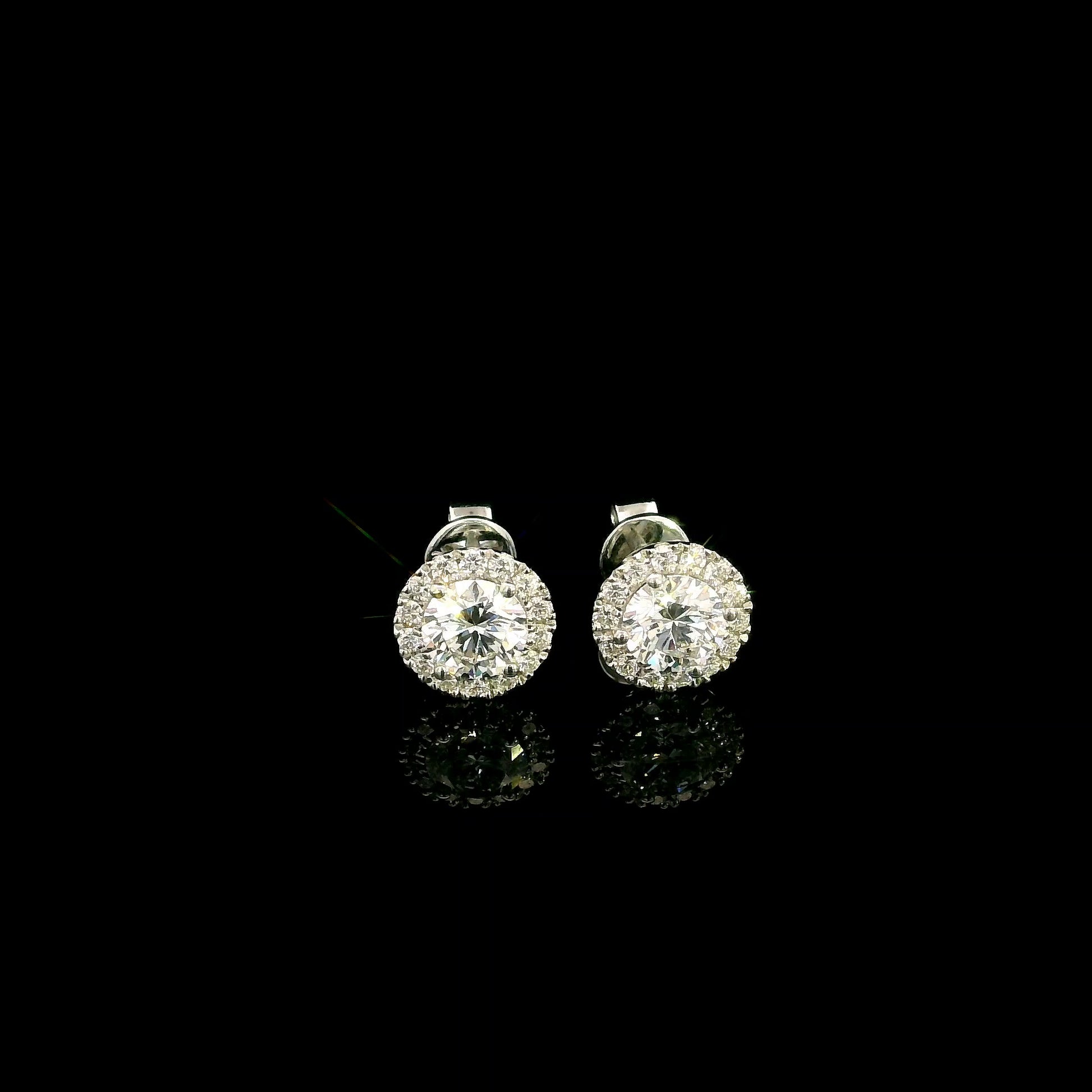 GIA certified round diamond halo stud earrings in 18K white gold with D colour natural centre diamonds