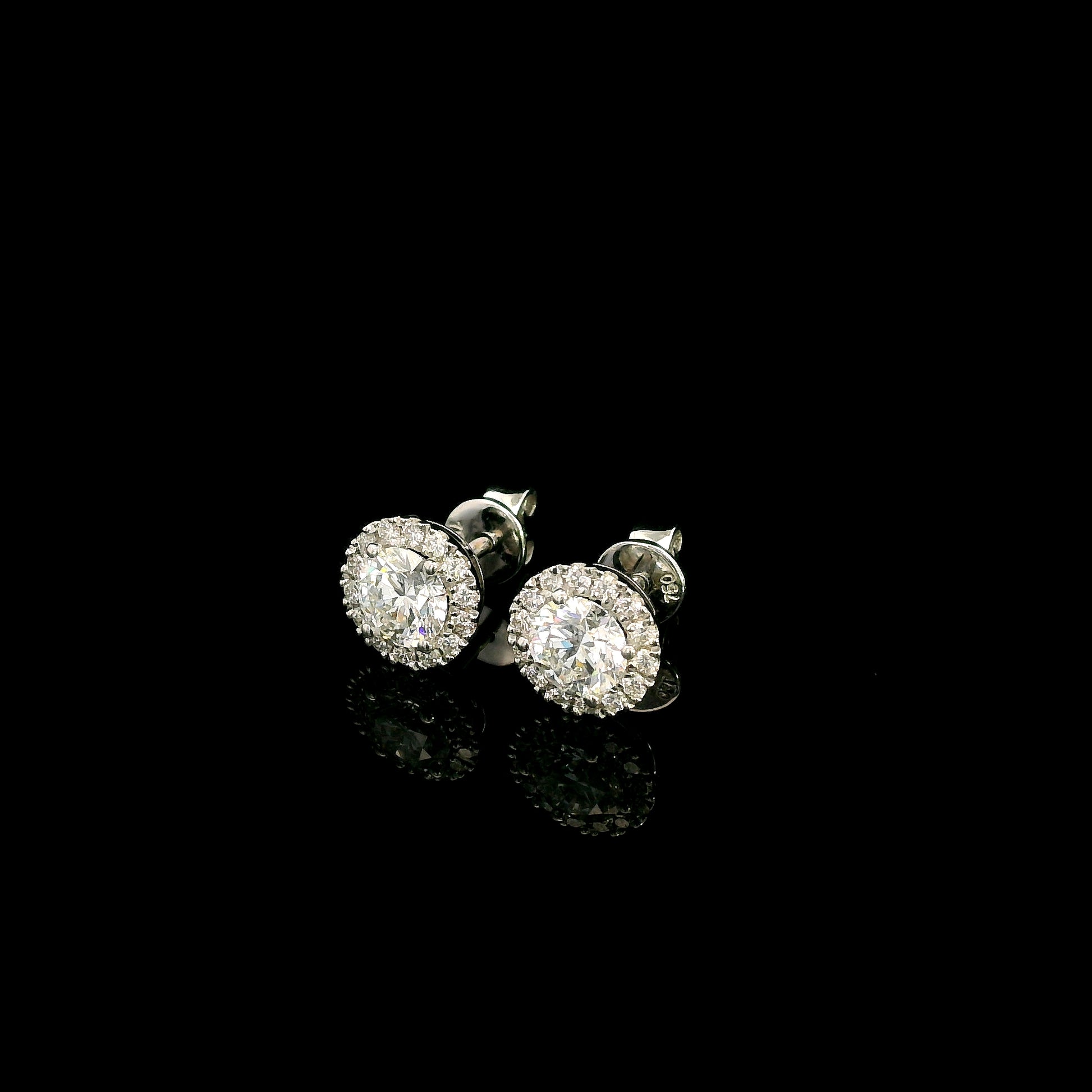 GIA certified round diamond halo stud earrings in 18K white gold with D colour natural centre diamonds
