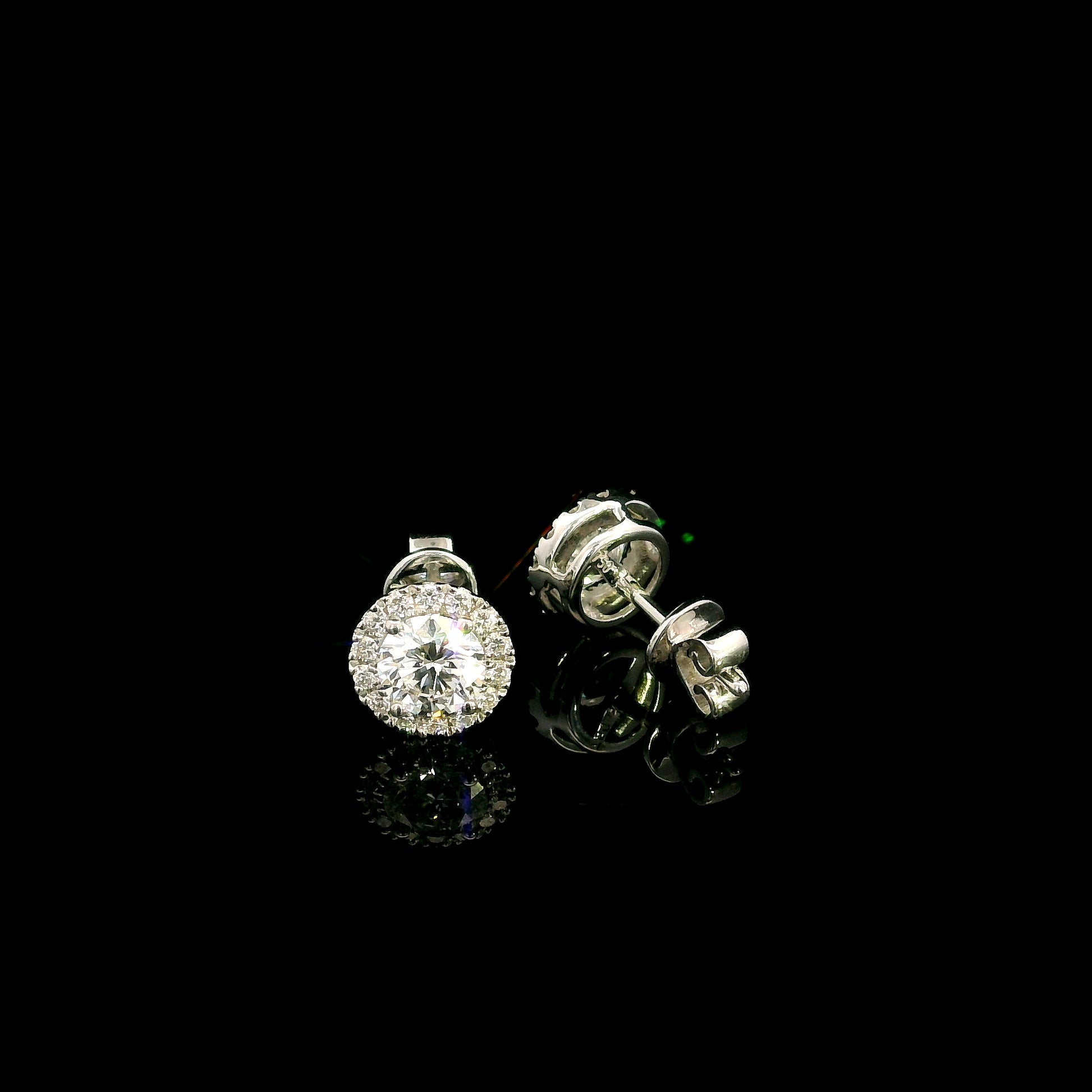 GIA certified round diamond halo stud earrings in 18K white gold with D colour natural centre diamonds