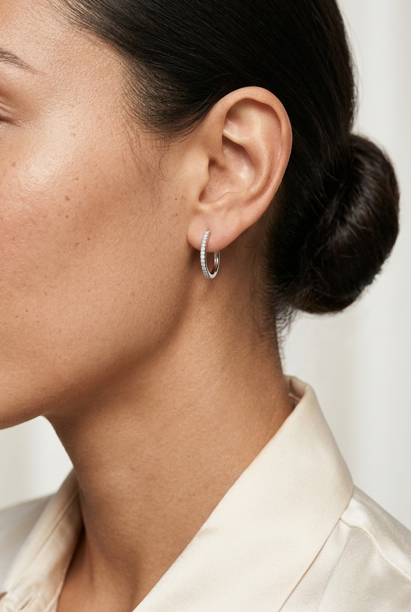 Pavé diamond hoop earrings in 18K white gold with 0.21 carat natural diamonds by Emirates Diamonds.