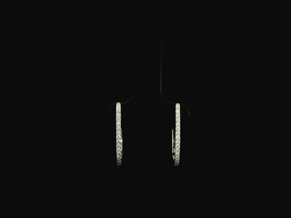 Pavé diamond hoop earrings in 18K white gold with 0.21 carat natural diamonds by Emirates Diamonds.