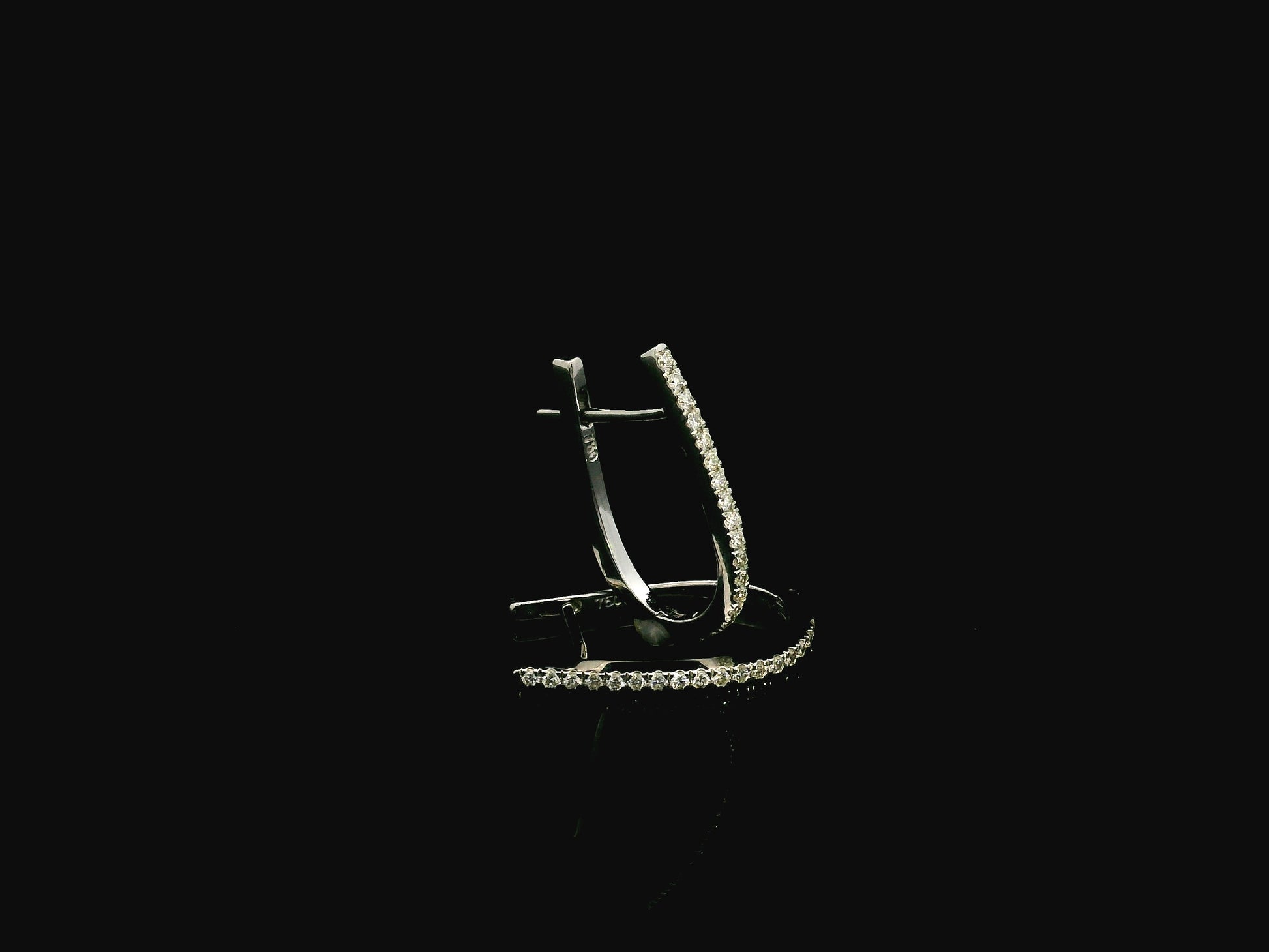 Pavé diamond hoop earrings in 18K white gold with 0.21 carat natural diamonds by Emirates Diamonds.