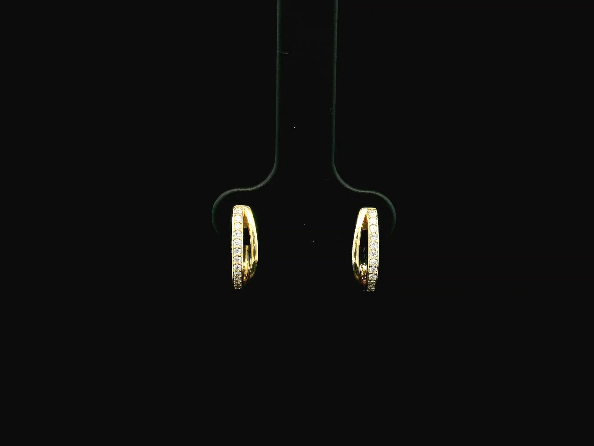 Small diamond huggie hoop earrings in 18K yellow gold by Emirates Diamonds