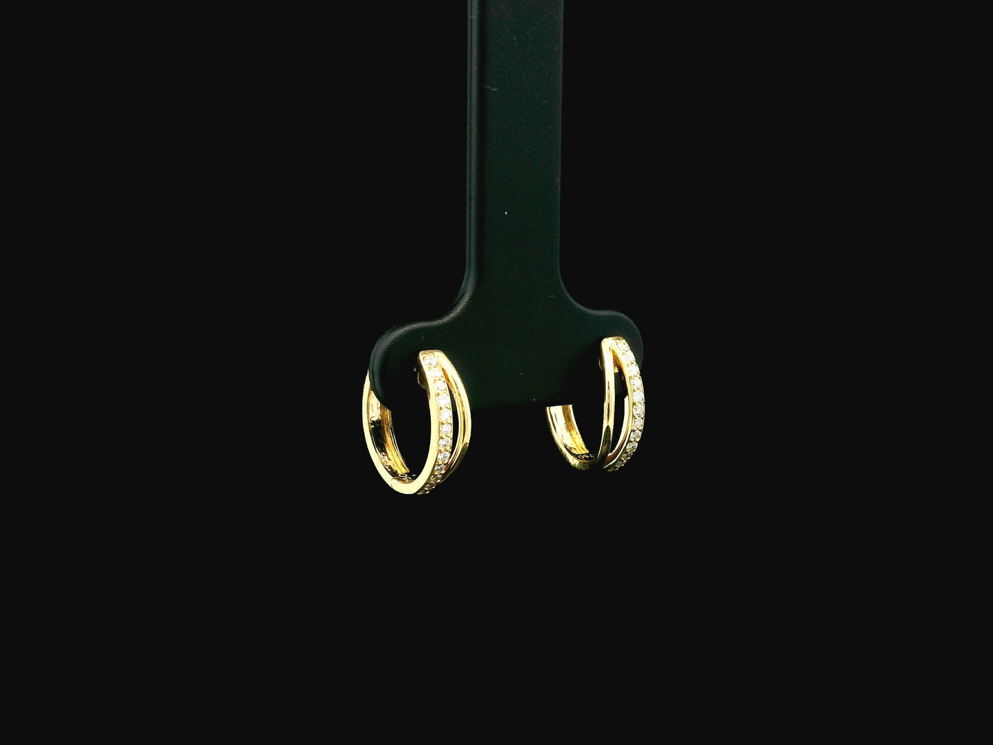 Small diamond huggie hoop earrings in 18K yellow gold by Emirates Diamonds
