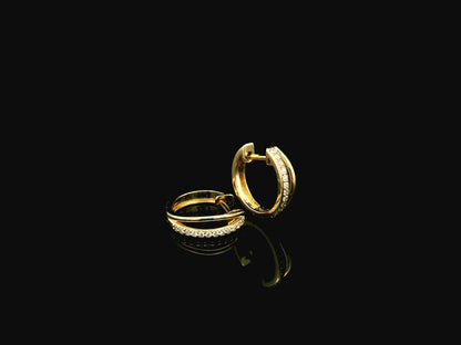 Small diamond huggie hoop earrings in 18K yellow gold by Emirates Diamonds
