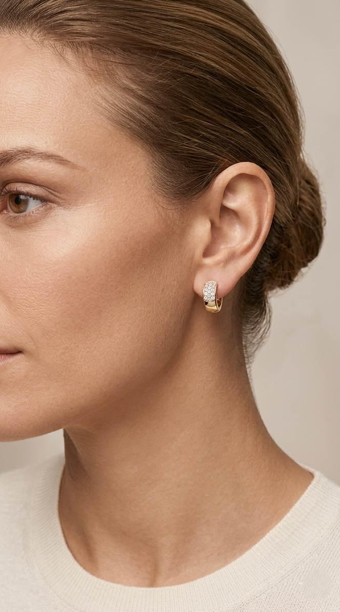 Diamond huggie hoop earrings in 18K yellow gold by Emirates Diamonds