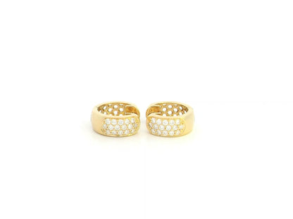 Diamond huggie hoop earrings in 18K yellow gold by Emirates Diamonds