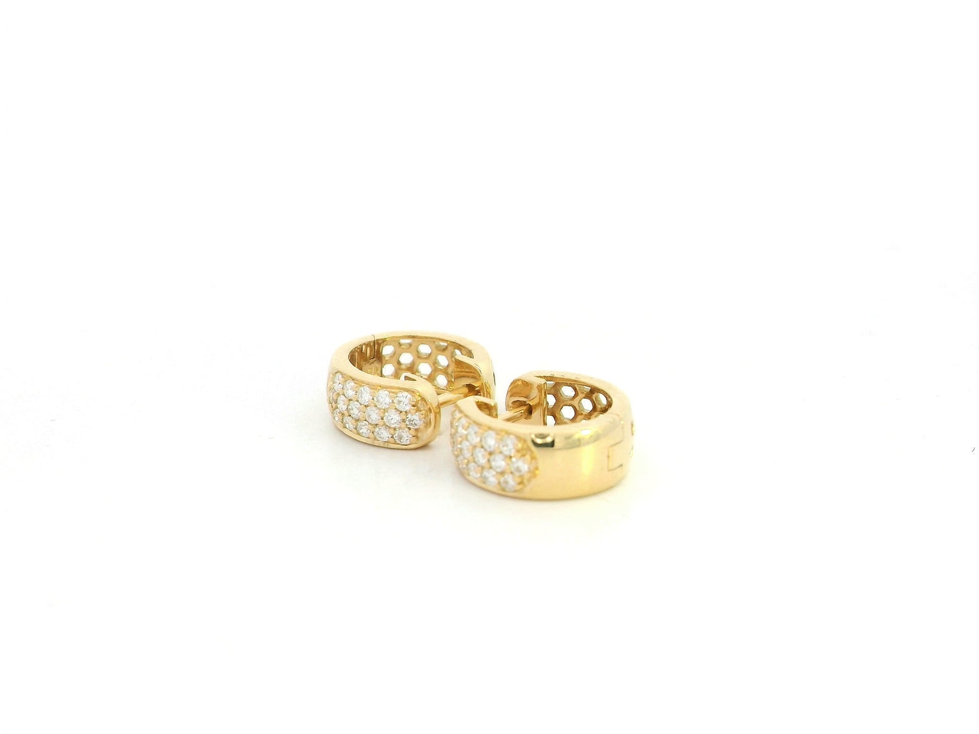 Diamond huggie hoop earrings in 18K yellow gold by Emirates Diamonds