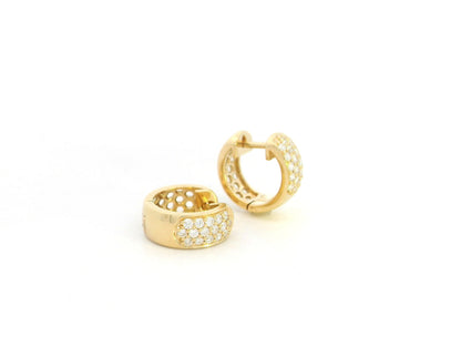 Diamond huggie hoop earrings in 18K yellow gold by Emirates Diamonds