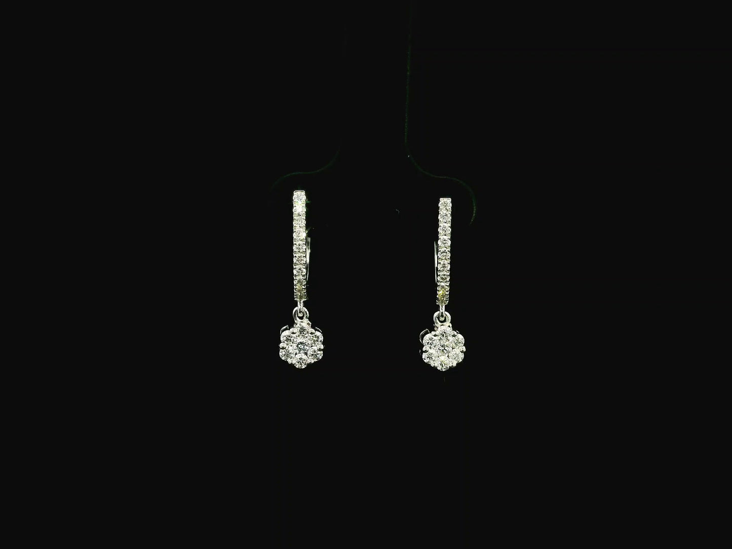 Diamond drop hoop earrings in 18K white gold featuring 0.59 carats of diamonds by Emirates Diamonds.