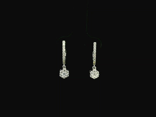 Diamond drop hoop earrings in 18K white gold featuring 0.59 carats of diamonds by Emirates Diamonds.