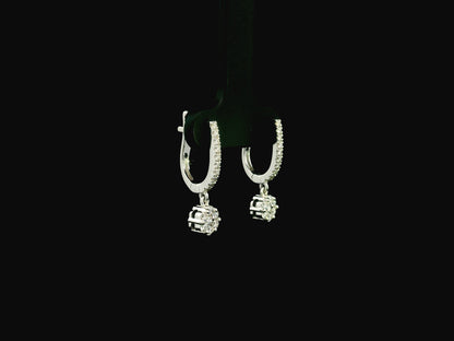 Diamond drop hoop earrings in 18K white gold featuring 0.59 carats of diamonds by Emirates Diamonds.