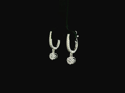 Diamond drop hoop earrings in 18K white gold featuring 0.59 carats of diamonds by Emirates Diamonds.