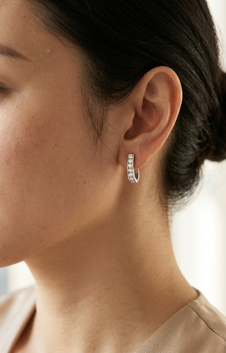 Diamond hoop earrings in 18K white gold featuring 0.98 carats of diamonds by Emirates Diamonds.
