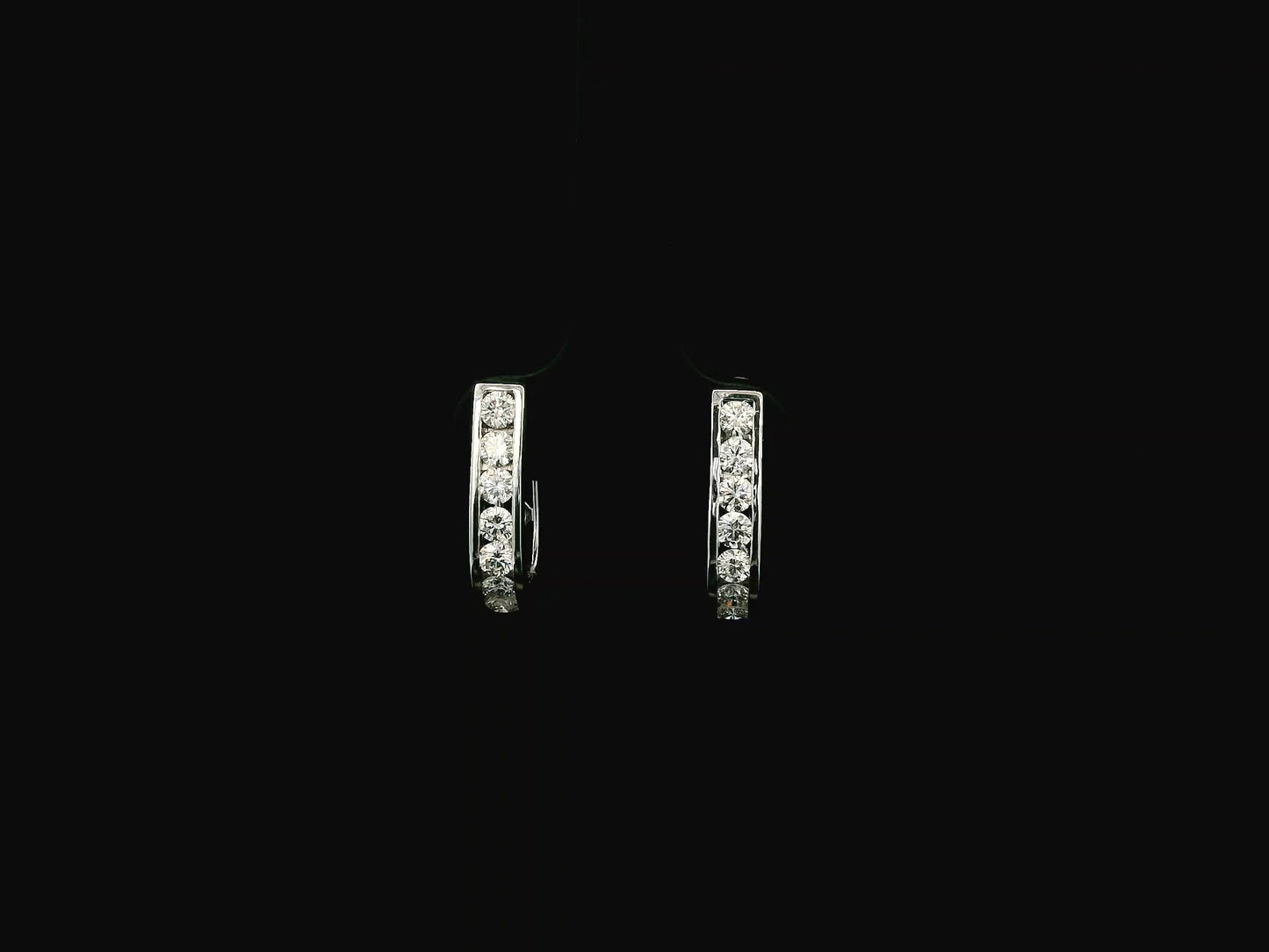 Diamond hoop earrings in 18K white gold featuring 0.98 carats of diamonds by Emirates Diamonds.